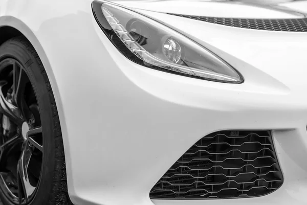 Close-up view of white sports car headlight. — Stock Photo, Image