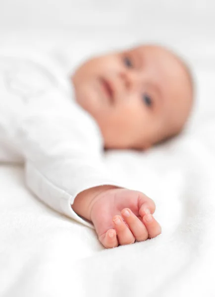 Cute little baby on the bed. Place for your text. — Stock Photo, Image