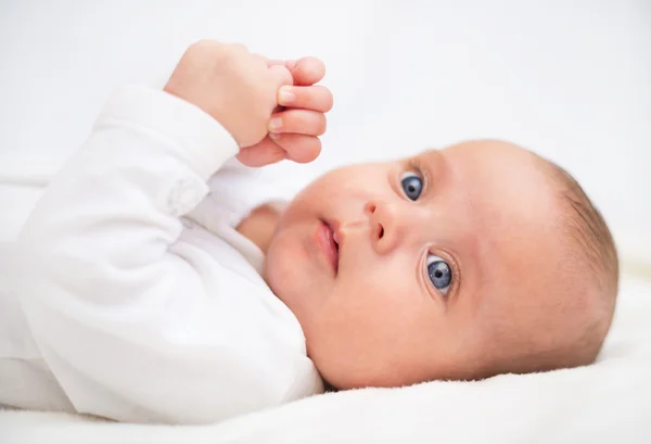 Cute little baby on the bed. Place for your text. — Stock Photo, Image