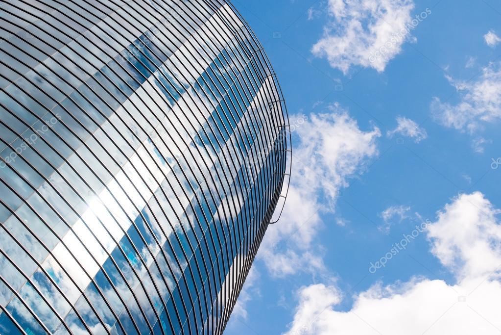 Modern round glass building in the city.