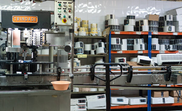 Madeira, Portugal - 27.01.2026: Wine bottling line and labels.