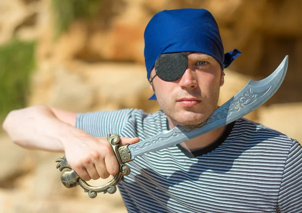 Male pirate with sword. Place for your text. — Stock Photo, Image