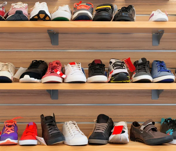 Big collection of different sport shoes. Stock Photo by ©mproduction