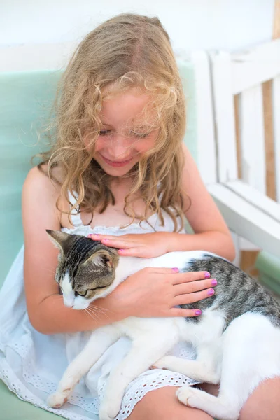 Cute little girl playing with cat. — Stock Photo, Image