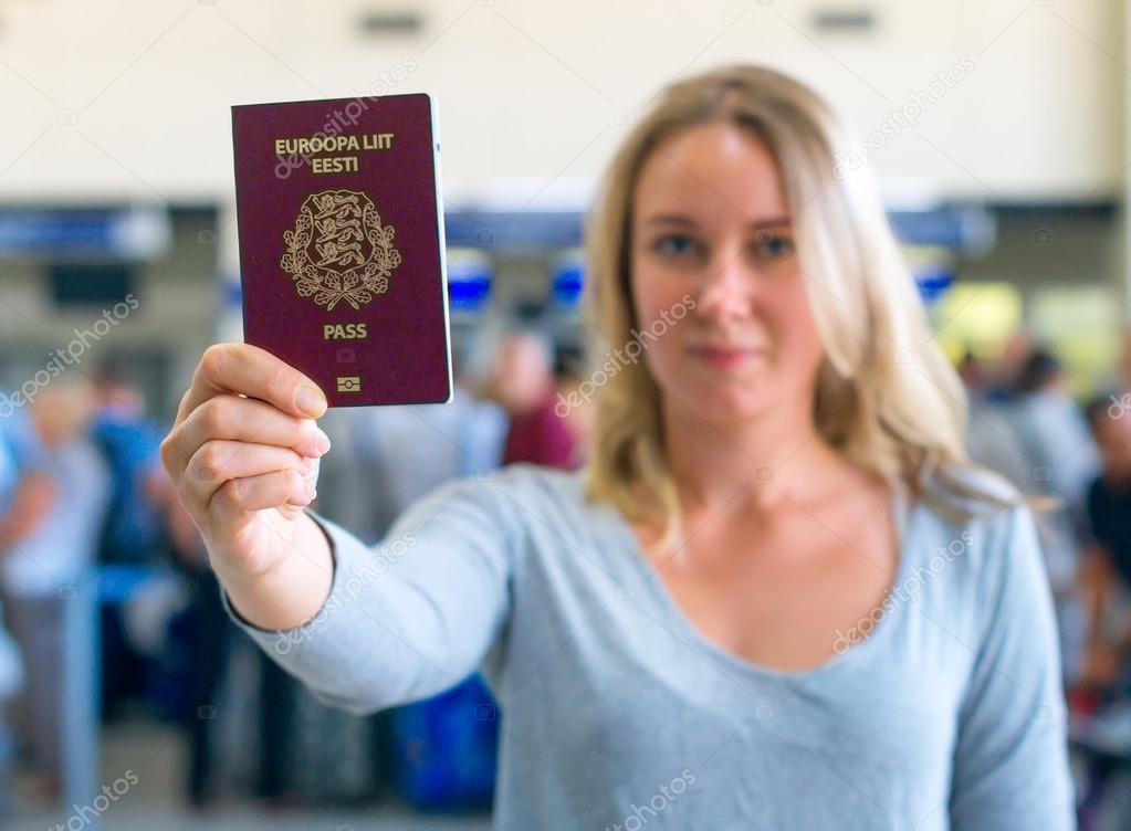 Woman showing europe union passport. Estonian citizenship.