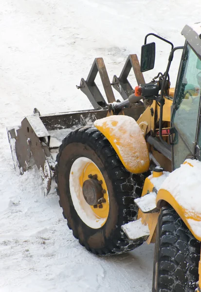 Tractor shoveling snow on the street. Space for your text. — Stock Photo, Image