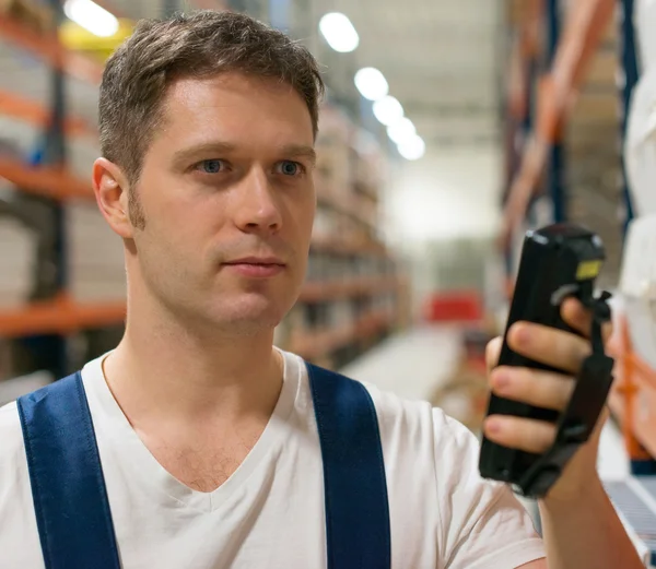 Supervisor scanning package barcode at the warehouse. — Stock Photo, Image