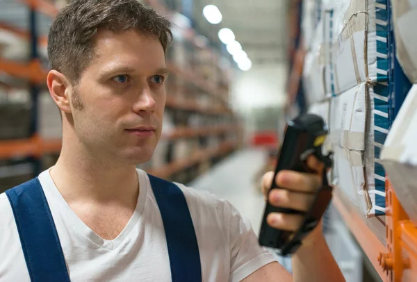 Supervisor scanning package barcode at the warehouse. — Stock Photo, Image