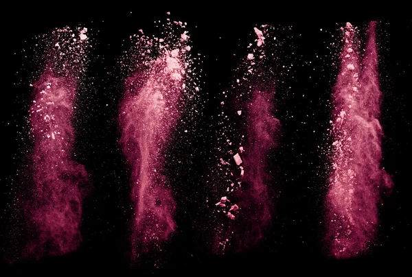 Red powders on black background — Stock Photo, Image