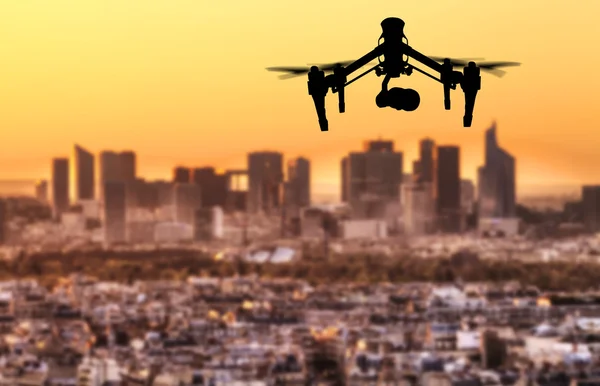 Drone silhouette flying above Paris city panorama — Stock Photo, Image