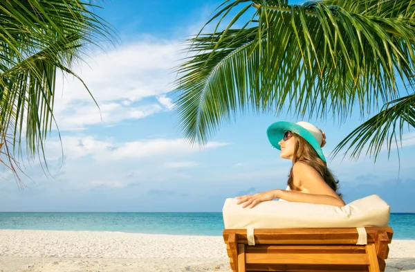 Woman relaxing on deckchair Stock Photo