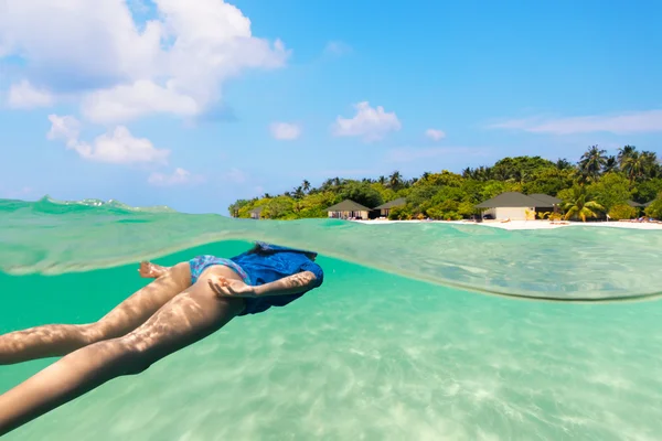 Young woman diver exploring sandy bottom — Stock Fotó