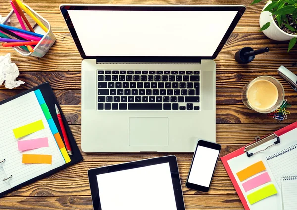 Laptop with other modern electonic devices on desk — Stock Photo, Image