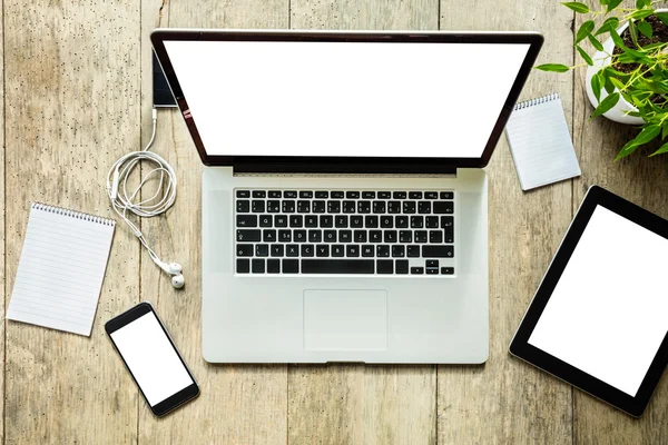 Laptop with other modern electonic devices on desk — Stock Photo, Image