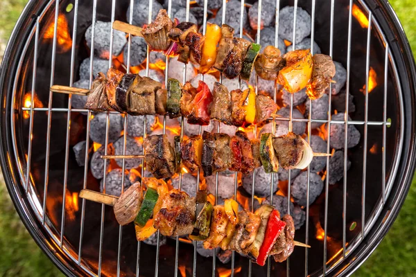 Grill with meat skewers — Stock Photo, Image