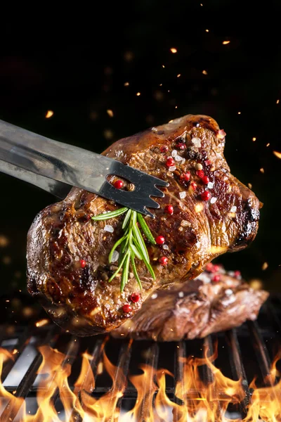 Beef steak on grill — Stock Photo, Image