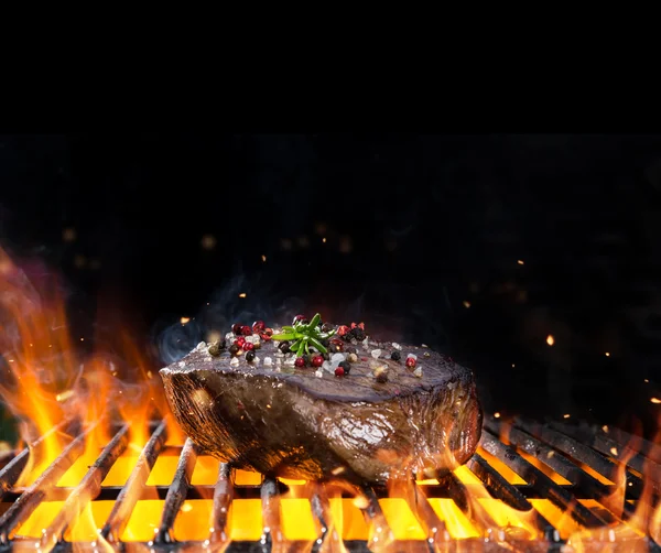 Beef steak on grill — Stock Photo, Image