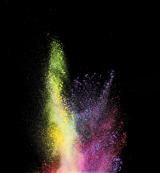 Explosão de pó colorido sobre fundo preto — Fotografia de Stock