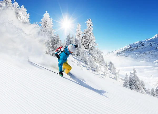 Skier on piste running downhill — Stock Photo, Image