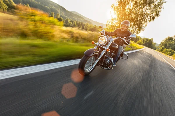 Motorcycle driver riding on motorway — Stock Photo, Image