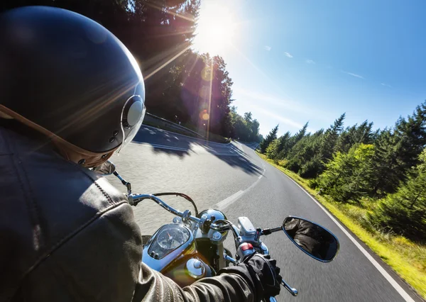 Motorcycle driver riding on motorway — Stock Photo, Image