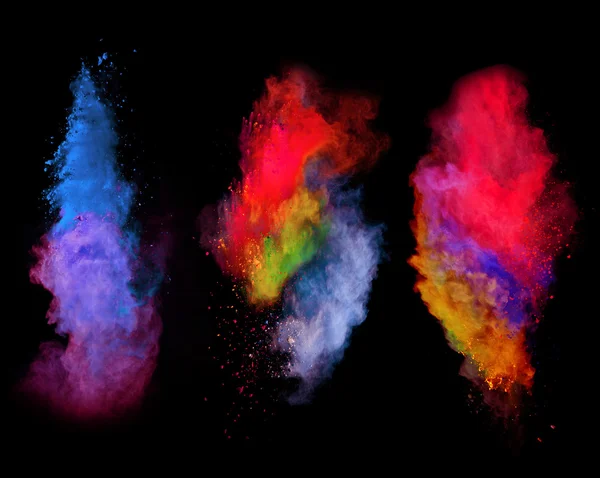 Explosiones de polvo de color sobre fondo negro — Foto de Stock