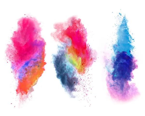 Explosions of colored powder on white background — Stock Photo, Image