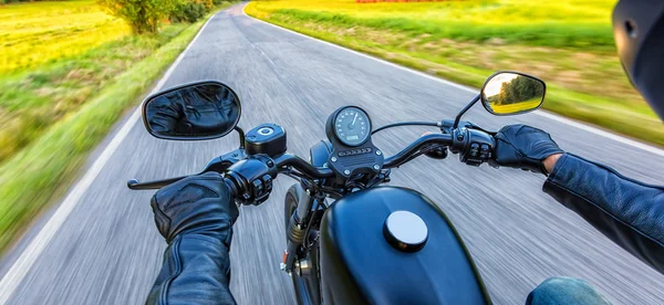 Motorcycle driver riding on motorway — Stok Foto