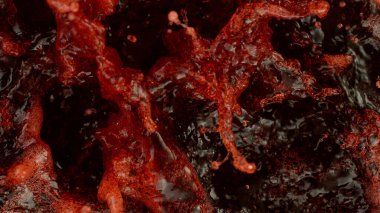 Splashing red wine texture, top view, studio shot