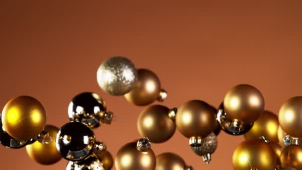 Super Slow Motion Flying Christmas Balls Isolated Colored Background Filmado — Vídeo de Stock