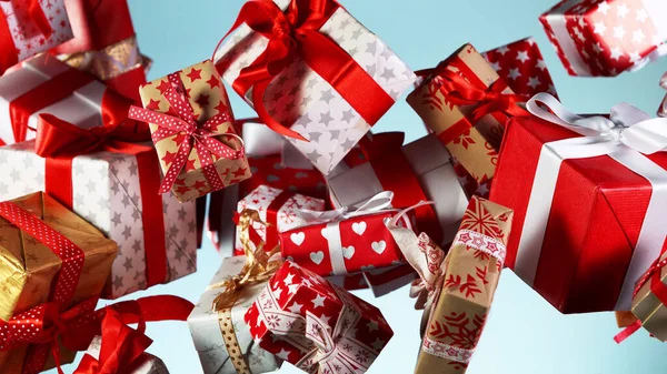 Flying Christmas Gifts Coloured Background Concept Celebrating Studio Shot — Stock Photo, Image