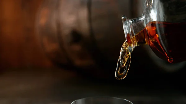 Bottle Whisky Splashing Liquid Detail Pouring Still Life Wooden Barell — Stock Photo, Image