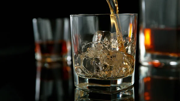 Glass Whisky Splashing Liquid Ice Rocks Studio Shot Isolated Black — Stock Photo, Image