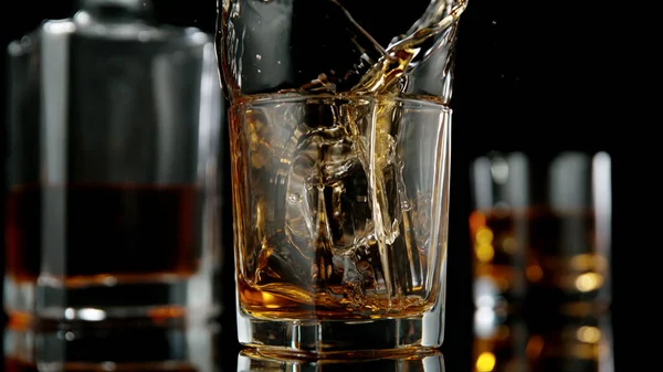 Glass Whisky Splashing Liquid Ice Rocks Studio Shot Isolated Black — Stock Photo, Image