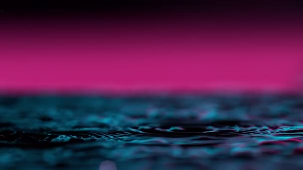 Super Slow Motion Splashing Water Crown Illuminated Neon Lights Filmed — Stock Video