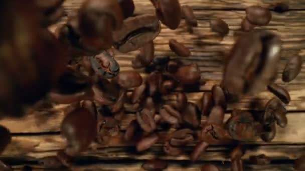 Super Slow Motion Falling Coffee Beans Wooden Background Filmed High — Stock Video
