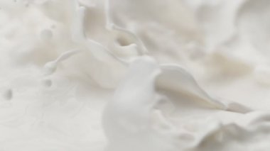 Makro çekimde süt sıvısı sallamak çok yavaş bir hareket. Yüksek hızlı sinema kamerası, 1000fps.