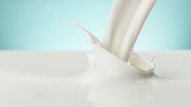 Super Slow Motion Pouring Milk Soft Blue Background Filmed High — Stock Video