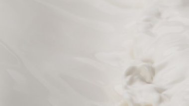 Makro çekimde süt sıvısı sallamak çok yavaş bir hareket. Yüksek hızlı sinema kamerası, 1000fps.