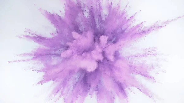 Explosion of colored powder isolated on white background