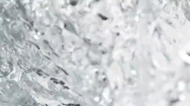 Su sıçratmada süper yavaş çekim, yakın çekim. Yüksek hızlı sinema kamerası, 1000 fps..