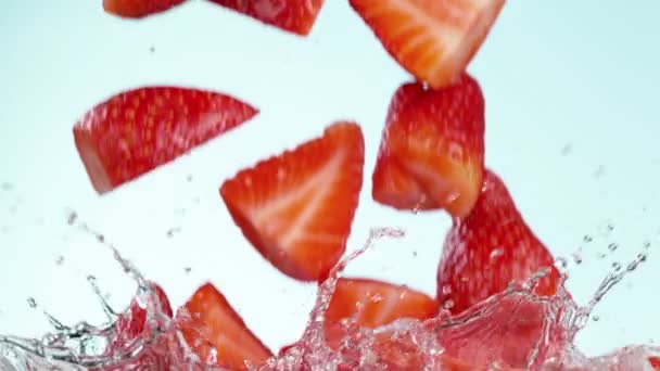 Super Slow Motion Falling Strawberries Cuts Splashing Water Filmed High — Stock Video