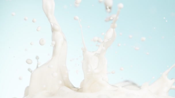 Super Slow Motion Milk Splashes Blue Background Filmed High Speed — Stock Video