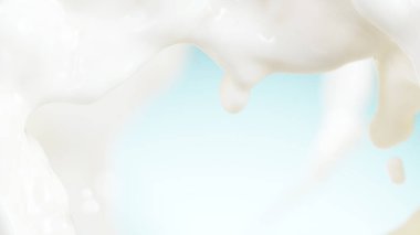 Yumuşak mavi arka planda süt ya da günlük krema damlası.