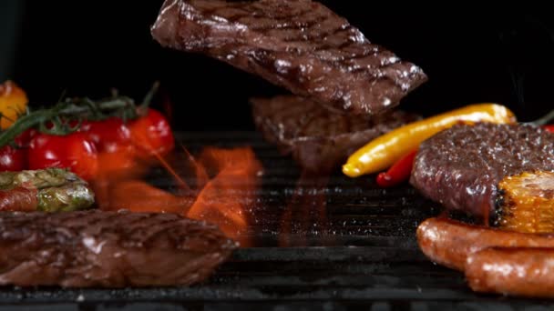 Super Slow Motion Beef Steak Falling Grill Fire Black Background — Stock Video