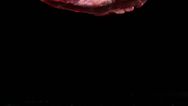 Flying Pieces Raw Beef Steaks Falling Table Filmed High Speed — Stock Video