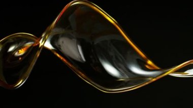 Siyah arka planda çok yavaş sıçrayan yağ döngüsü. Yüksek hızlı sinema kamerası, 1000 fps..