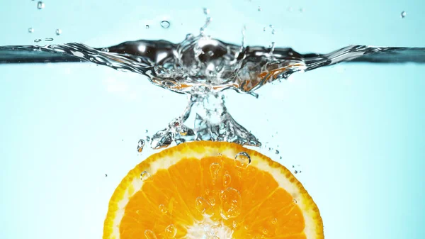 Fresh Orange Slice Dropped Water Splash Studio Shot Clear Background Royalty Free Stock Photos