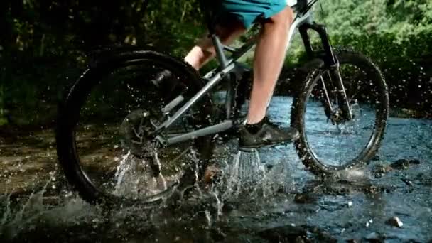 Super Slow Motion Mountain Biker Passing River Speed Ramp Effect — Stock Video