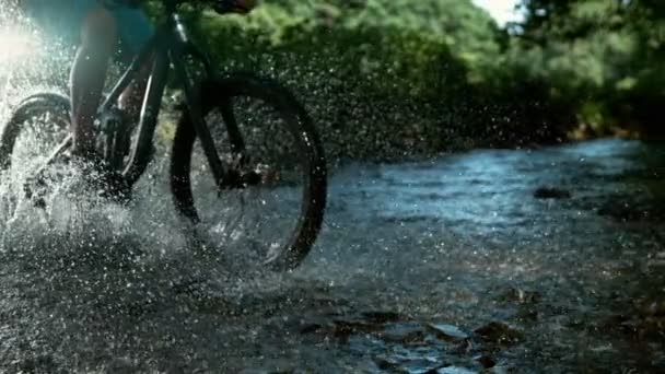 Super Slow Motion Mountain Bikers Passing River Filmed High Speed — Stock Video